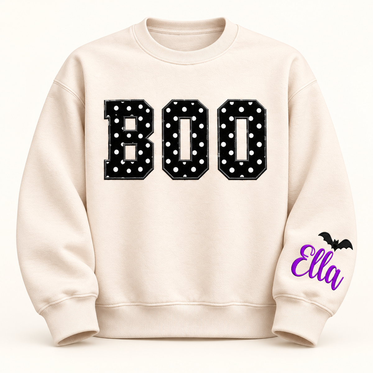 Label Stitch Studio cream fleece crewneck sweatshirt with black polka-dot BOO appliqué and personalized sleeve icon