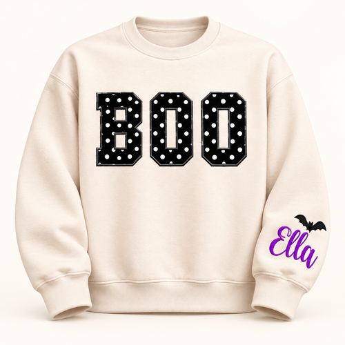 Label Stitch Studio cream fleece crewneck sweatshirt with black polka-dot BOO appliqué and personalized sleeve icon