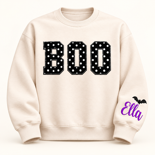 Label Stitch Studio cream fleece crewneck sweatshirt with black polka-dot BOO appliqué and personalized sleeve icon